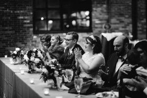 Couple clapping at wedding