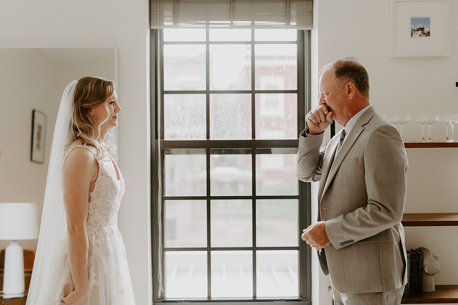 Dad and daughter seeing each other for the first time on wedding day
