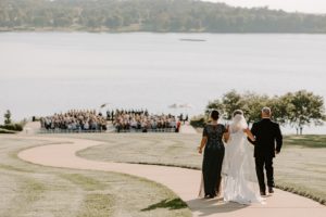 bride walking down hill toward ceremony at Innsbrook resort wedding