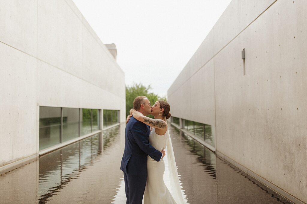 Bride and groom kiss at Pulitzer Arts Foundation in St. Louis, Missouri