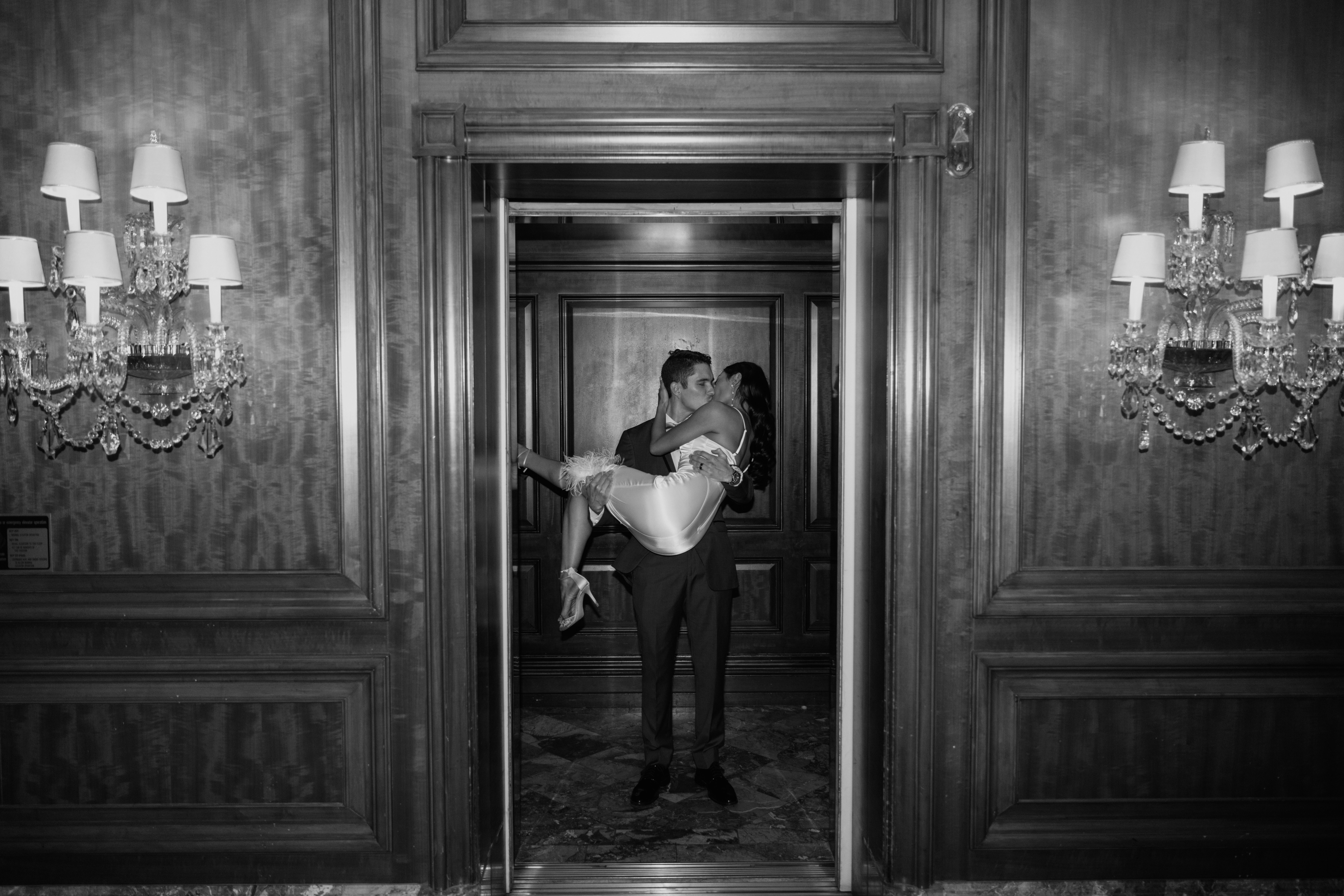 Couple kissing in elevator at Ritz Carlton St. Louis