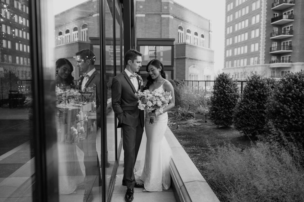 Black and white image of bride and groom looking at each other outside the Ritz-Carlton St. Louis wedding