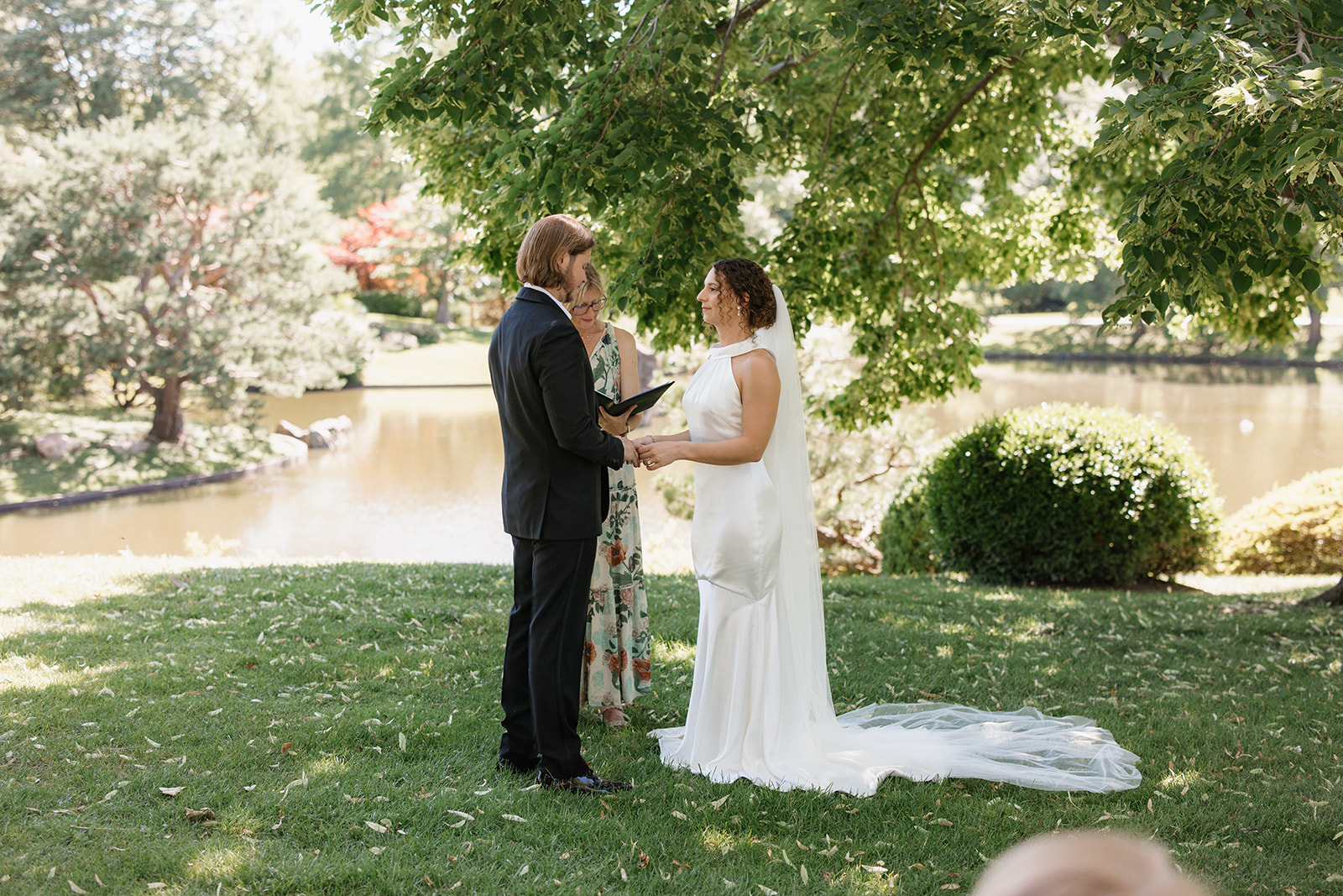 Couple during wedding ceremony at Missouri Botanical Gardens