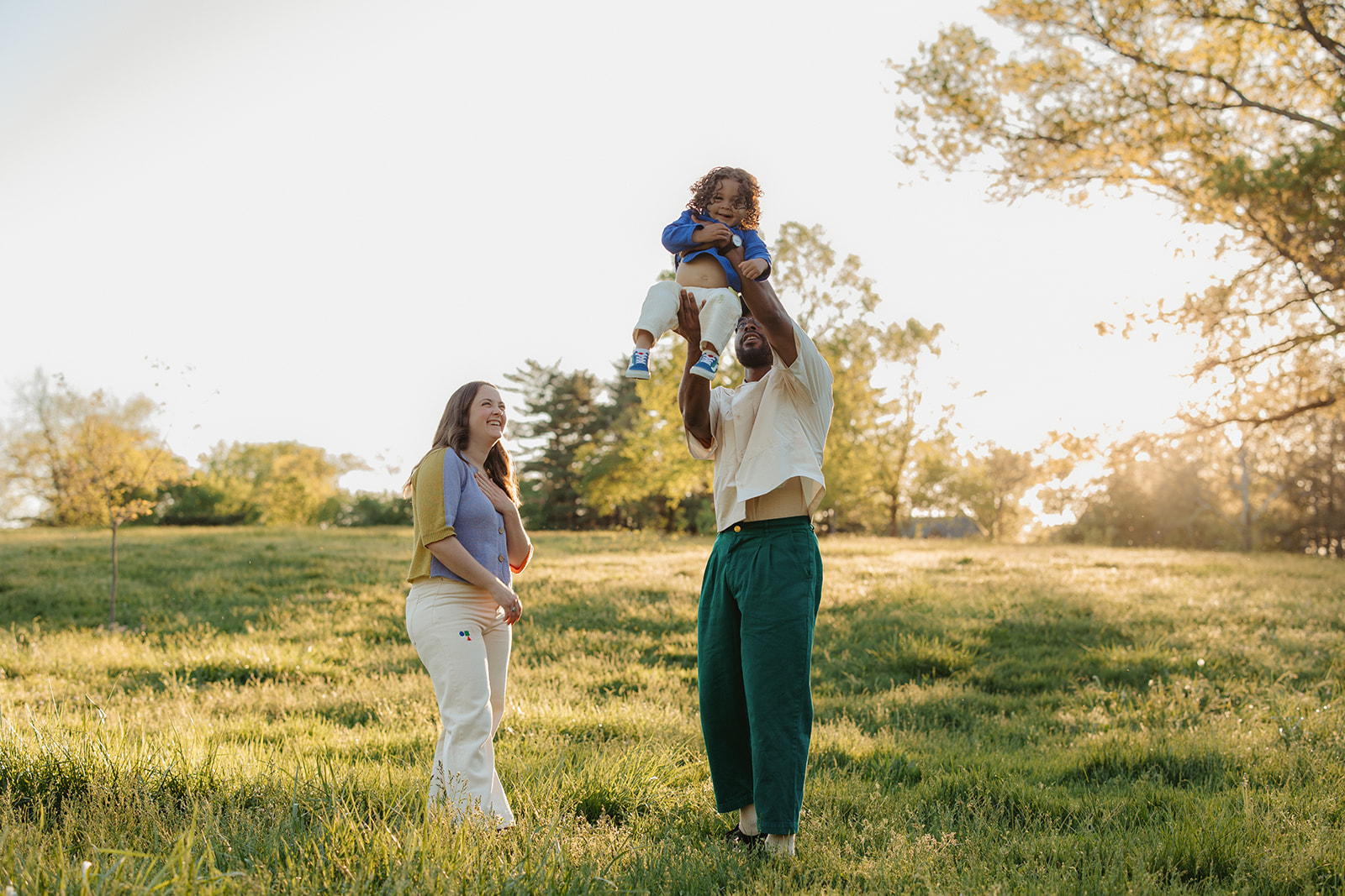 Family playing together in Francis Park in St. Louis