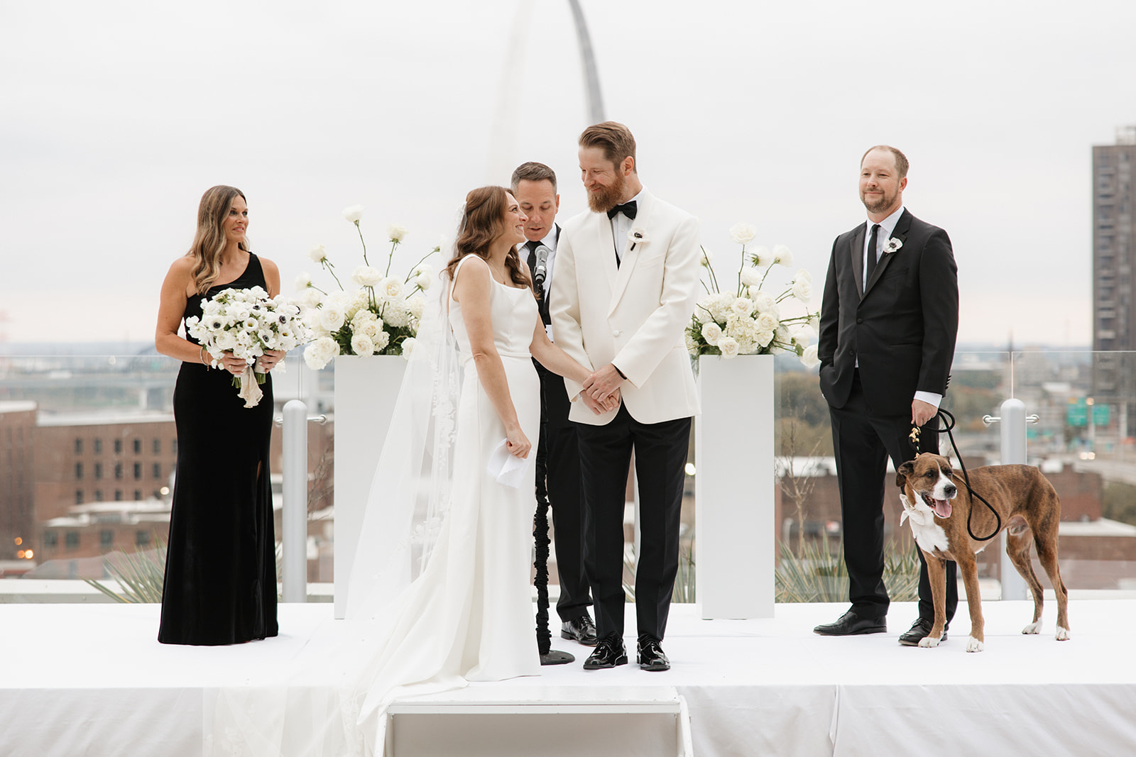 Bride and groom looking at each other during outdoor ceremony at Four Seasons Hotel St. Louis wedding