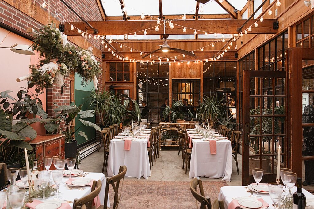 A photo of tables decorated with greenery and plates at Verde on Cherokee in St. Louis, Missouri.