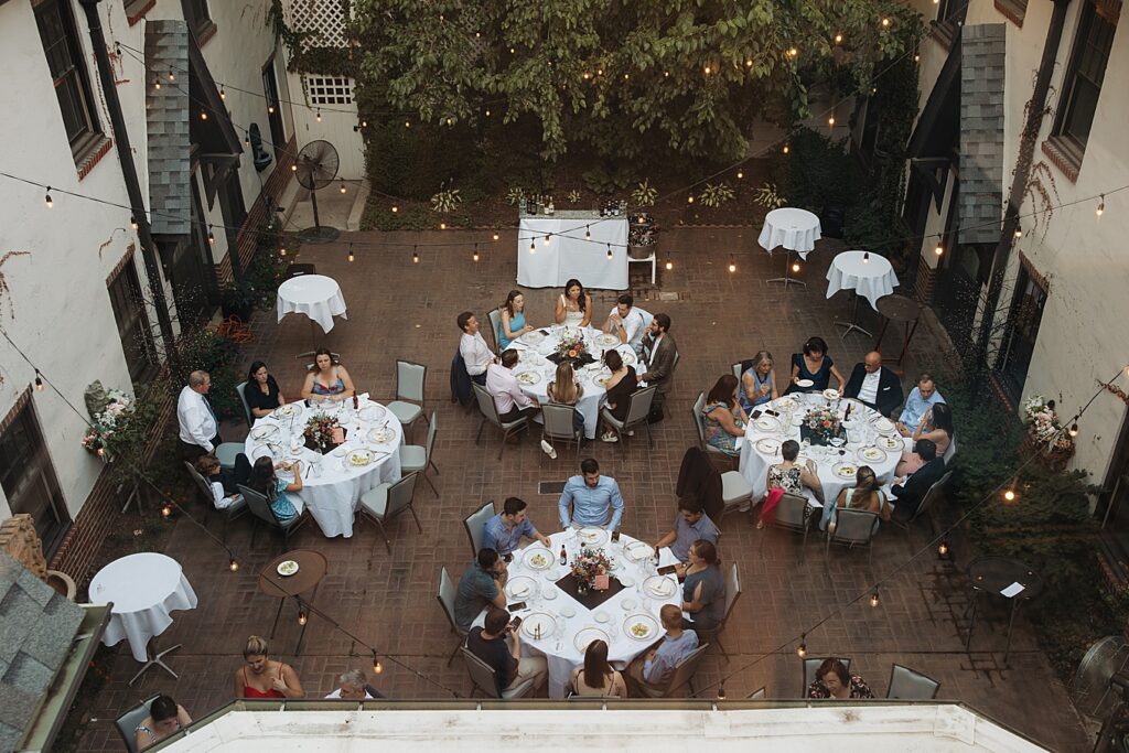 Birds eye view of courtyard wedding rehearsal at Seven Gables Inn in St. Louis.