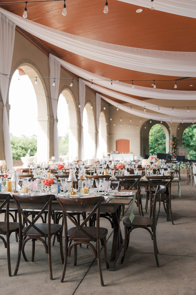 Colorful wedding reception at World’s Fair Pavilion with eclectic tablescapes inspired by Meet Me in St. Louis

