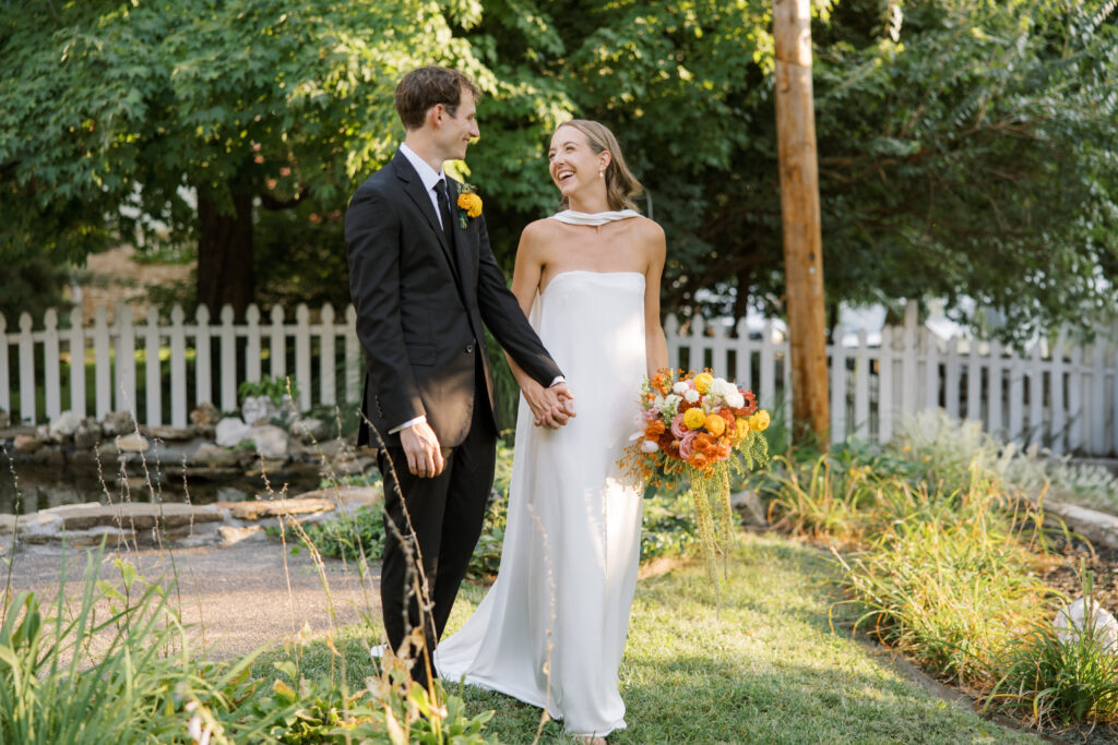 Candid portrait of the newlyweds laughing together during their wedding at The Lemp Mansion in St. Louis.