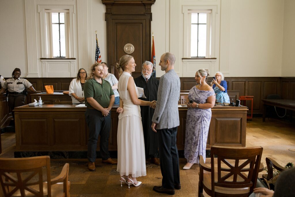 Candid wedding photo of Olivia and Zach during their St. Louis courthouse ceremony